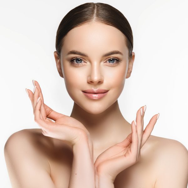 Beautiful Young Woman with Clean Fresh Skin . Facial  treatment   . Cosmetology , beauty  and spa . Nice and attractive girl with a pleasant smile.